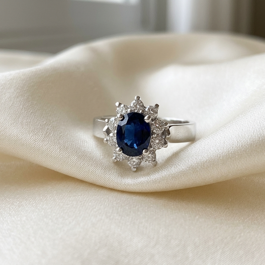 Oval Australian blue sapphire and diamond ring in white gold - side view