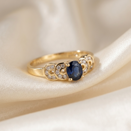 Oval Ceylon sapphire ring with scalloped diamond surround - side view