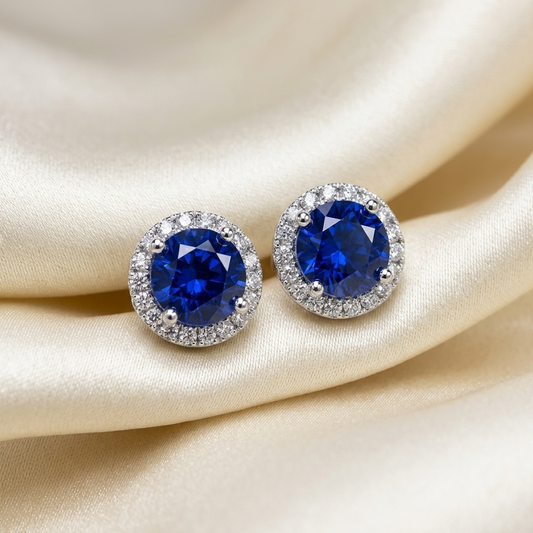Sapphire and diamond halo earrings - angled view