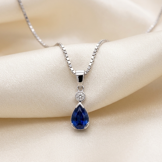 Pear shape sapphire and diamond pendant - angled view