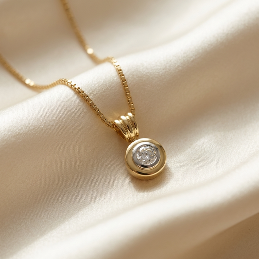Two tone bezel set round diamond pendant - side view