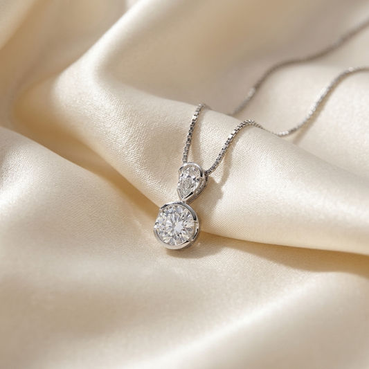 Pear shape and round diamond pendant - side view