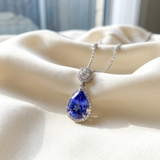 Pear shape tanzanite and diamond halo pendant - side view