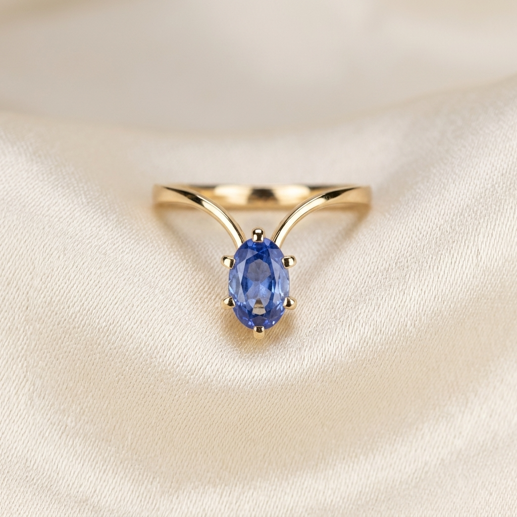 Oval Ceylon blue sapphire ring in yellow gold - angled view