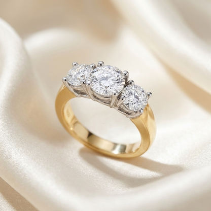 Anouk round brilliant diamond three stone engagement ring, yellow and white gold, close-up