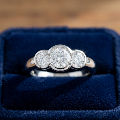 Coralie round brilliant diamond three stone engagement ring, top view
