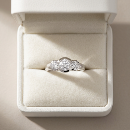 Coralie round brilliant diamond three stone engagement ring, three quarter view