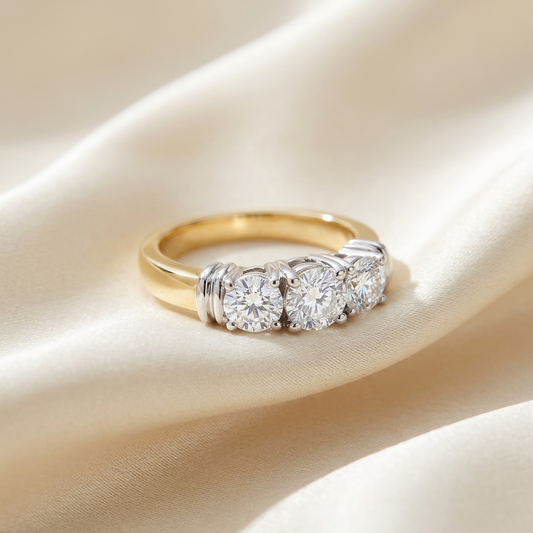 Sabine round brilliant diamond three stone engagement ring, angled view