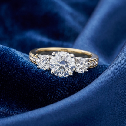 Penelope round brilliant diamond three stone engagement ring, side detail