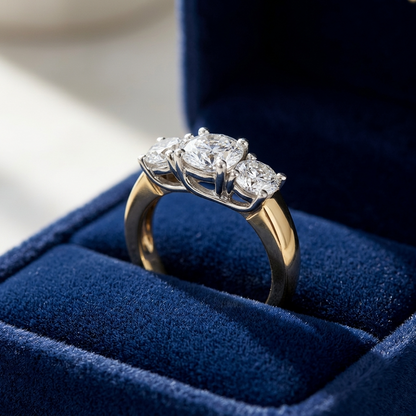 Rosalind round brilliant diamond three stone engagement ring in yellow gold, angled view
