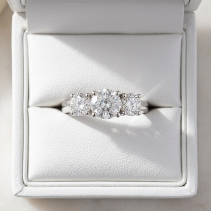 Eleanor round brilliant diamond three stone engagement ring detail