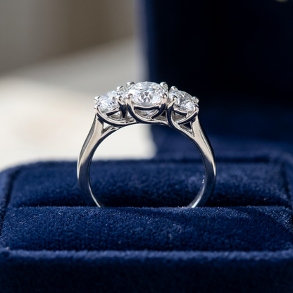 Eleanor round brilliant diamond three stone engagement ring, raised view