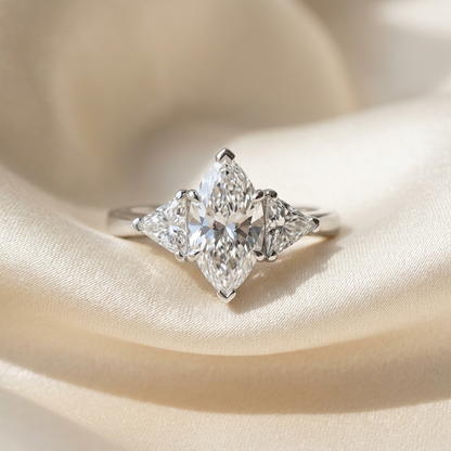 Margaux marquise cut diamond three stone engagement ring, angled view