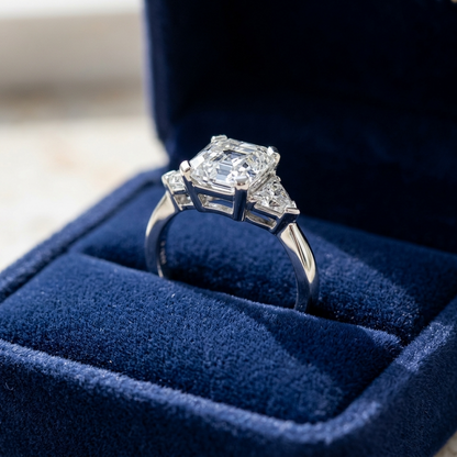 Beatrix Asscher cut diamond three stone engagement ring, side view