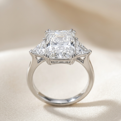 Delphine radiant cut diamond three stone engagement ring, angled view