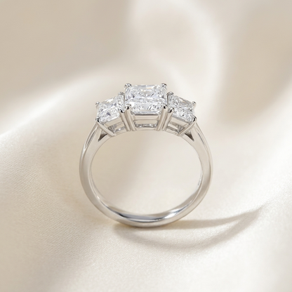 Colette radiant cut diamond three stone engagement ring, angled view