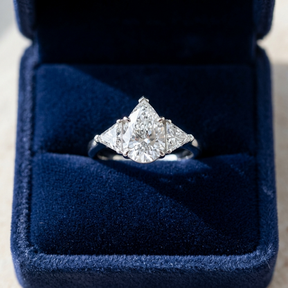 Genevieve pear shaped diamond three stone engagement ring on white gold band