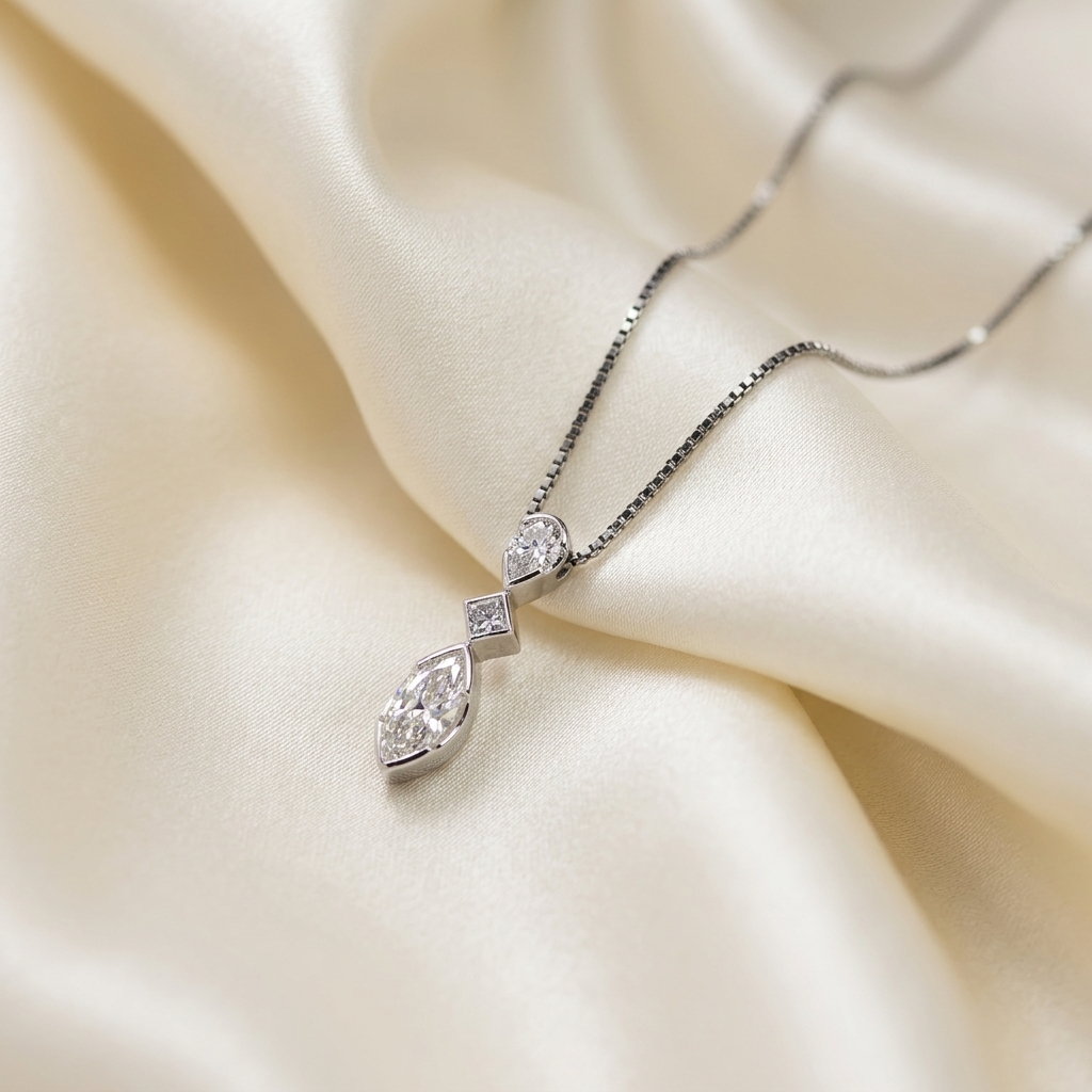 Three stone marquise diamond pendant - angled view
