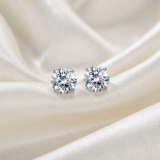 Four claw round diamond stud earrings in white gold