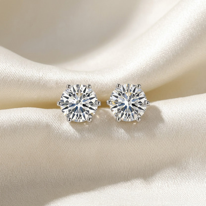 Six claw round diamond stud earrings - angled view