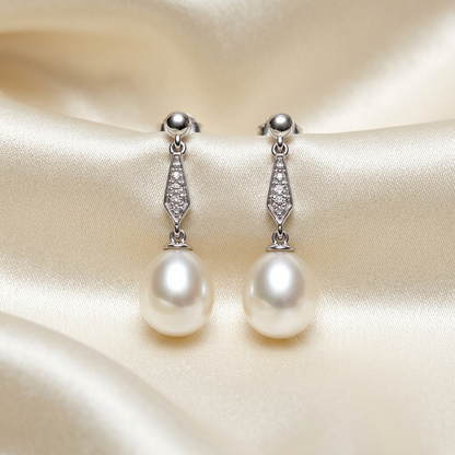 Antique style pearl and diamond drop earrings