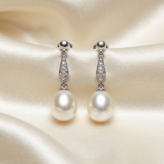 Antique style pearl and diamond drop earrings