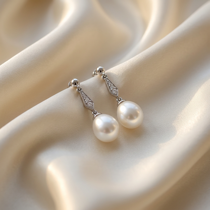Antique style pearl and diamond drop earrings - angled view