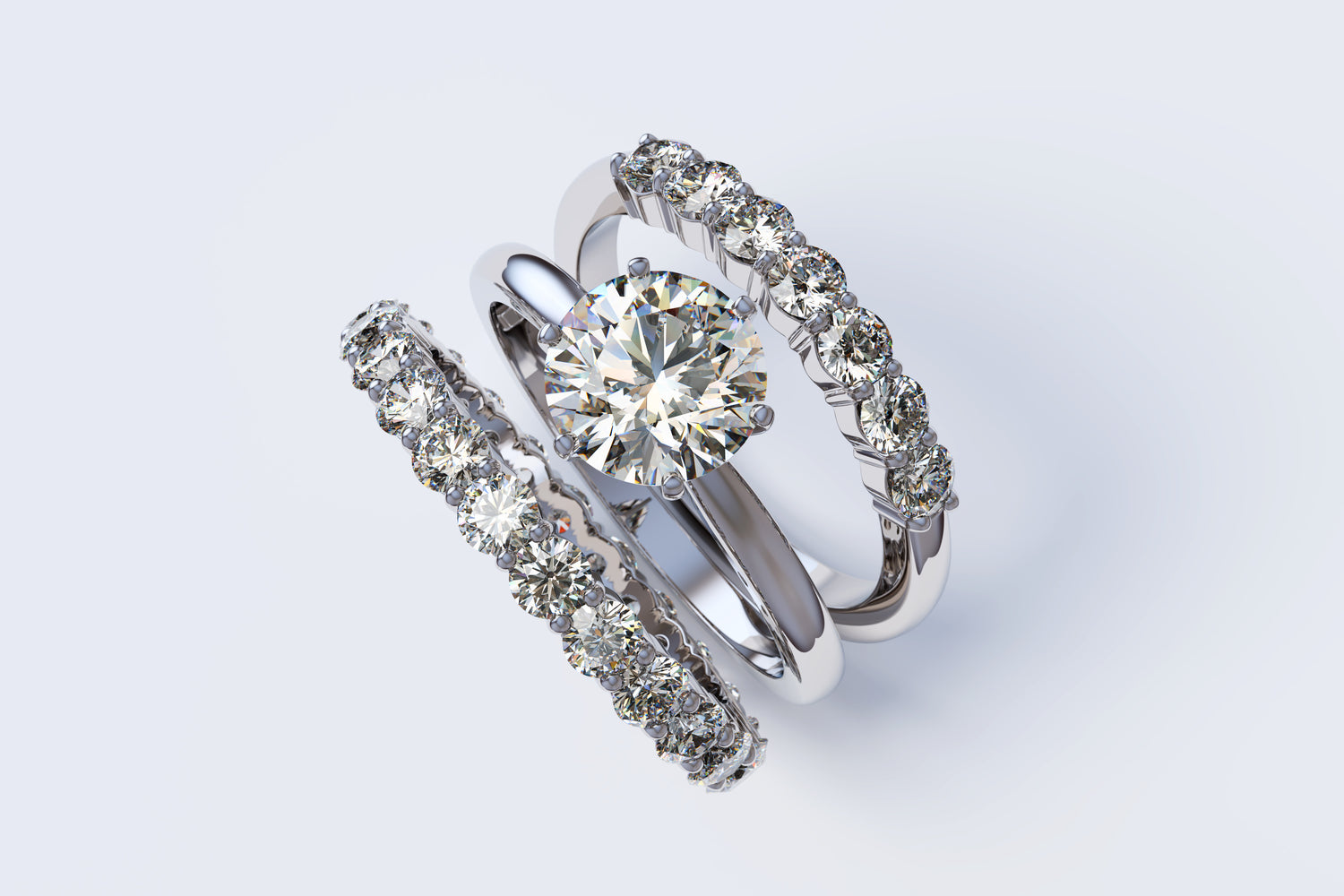 Pair of diamond rings on a light gray background