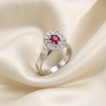 Oval ruby and diamond classic halo ring in 18ct white gold