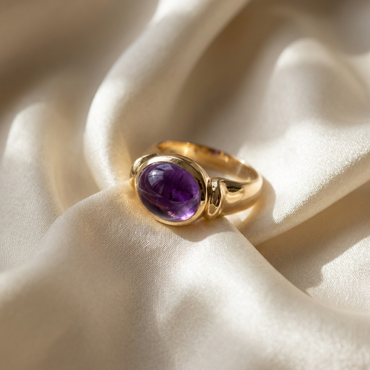 Oval cabochon amethyst gold dress ring