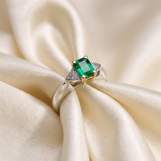 African emerald and trilliant cut diamond ring - side view