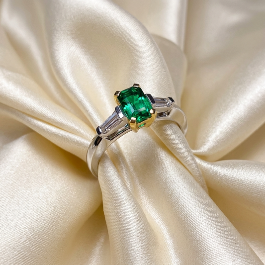 African emerald and tapered baguette diamond ring in 18ct white and yellow gold