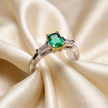 African emerald and tapered baguette diamond ring - angled view