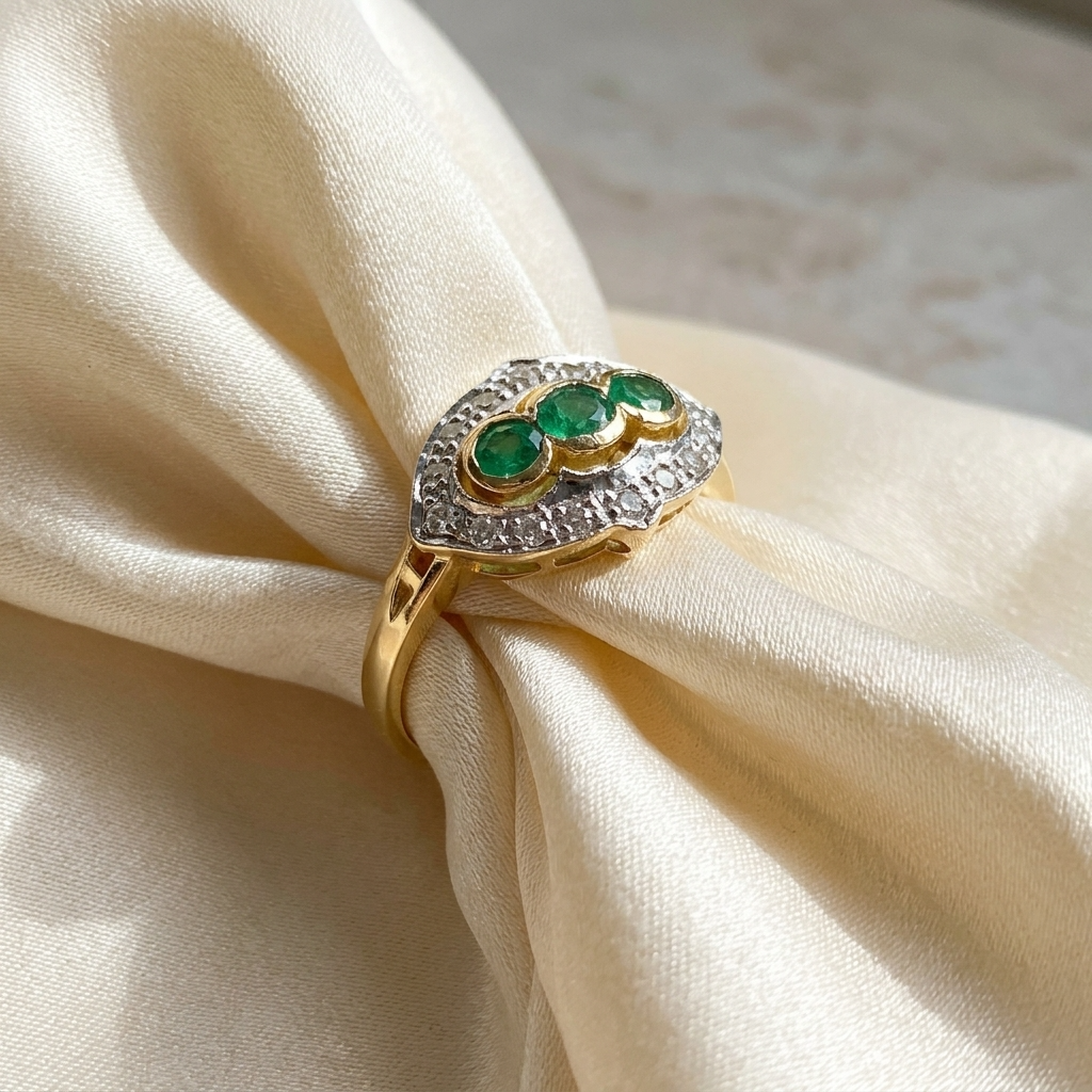 Antique style emerald and diamond dress ring - angled view
