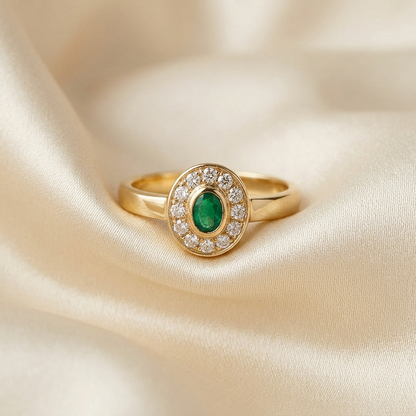Antique style oval emerald and diamond dress ring in 9ct yellow and white gold