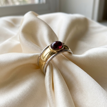 Garnet cabochon ring in yellow and white gold - angled view