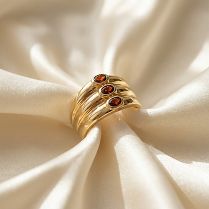 Garnet trilogy gold dome dress ring