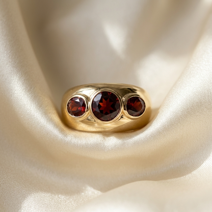 Garnet trilogy gold dome dress ring - angled view