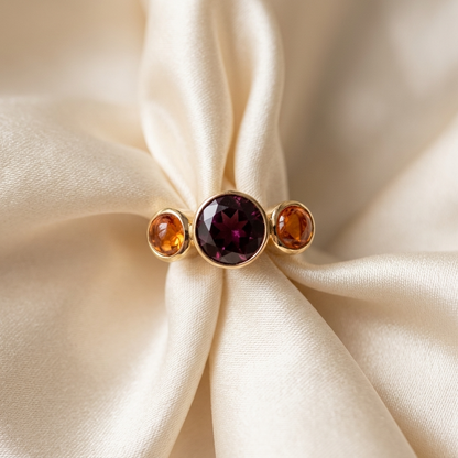 Citrine and garnet trilogy gold dress ring - angled view