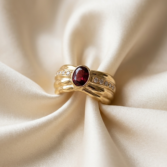 Oval garnet and diamond gold ring - side view