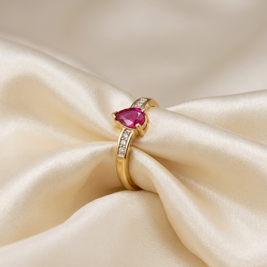 Pear shape ruby and diamond chevron ring in 18ct yellow gold