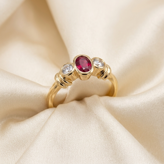 Oval red spinel and diamond ring in 18ct yellow gold