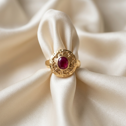 Oval natural ruby solitaire dress ring in yellow gold - side view