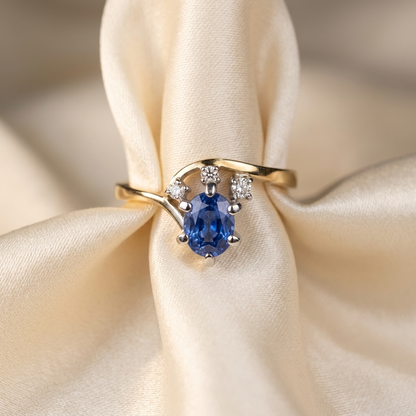 Oval Ceylon blue sapphire and diamond ring in 18ct yellow and white gold