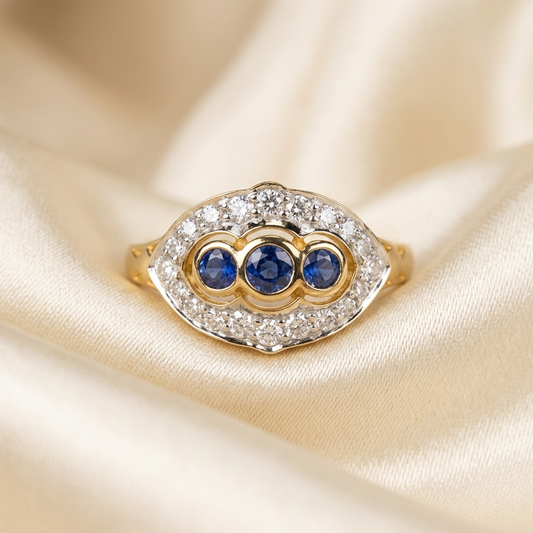 Antique style Ceylon sapphire and diamond ring in 9ct yellow and white gold