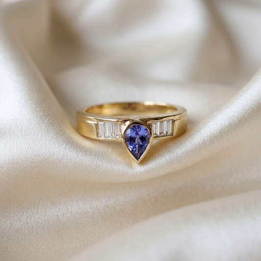 Pear shape Ceylon blue sapphire and baguette diamond ring in 18ct yellow and white gold