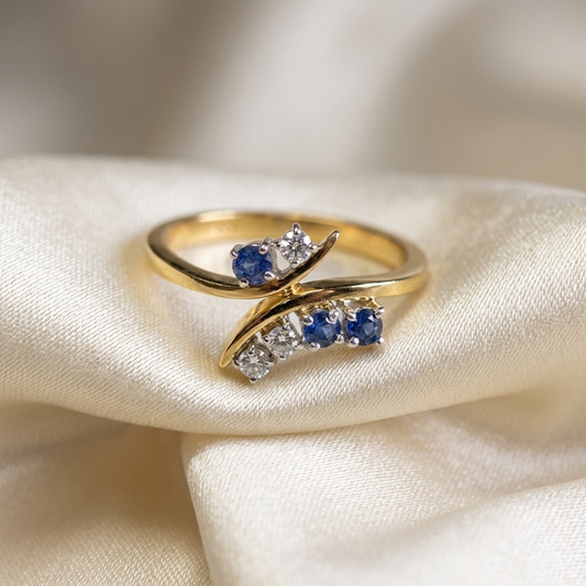 Sapphire and diamond wrap ring in 18ct yellow and white gold