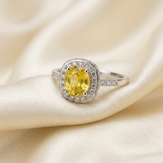 Cushion cut yellow sapphire and diamond halo ring in white gold - side view