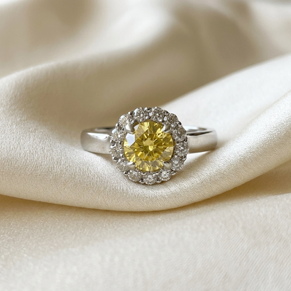 Round yellow sapphire and diamond halo ring - angled view