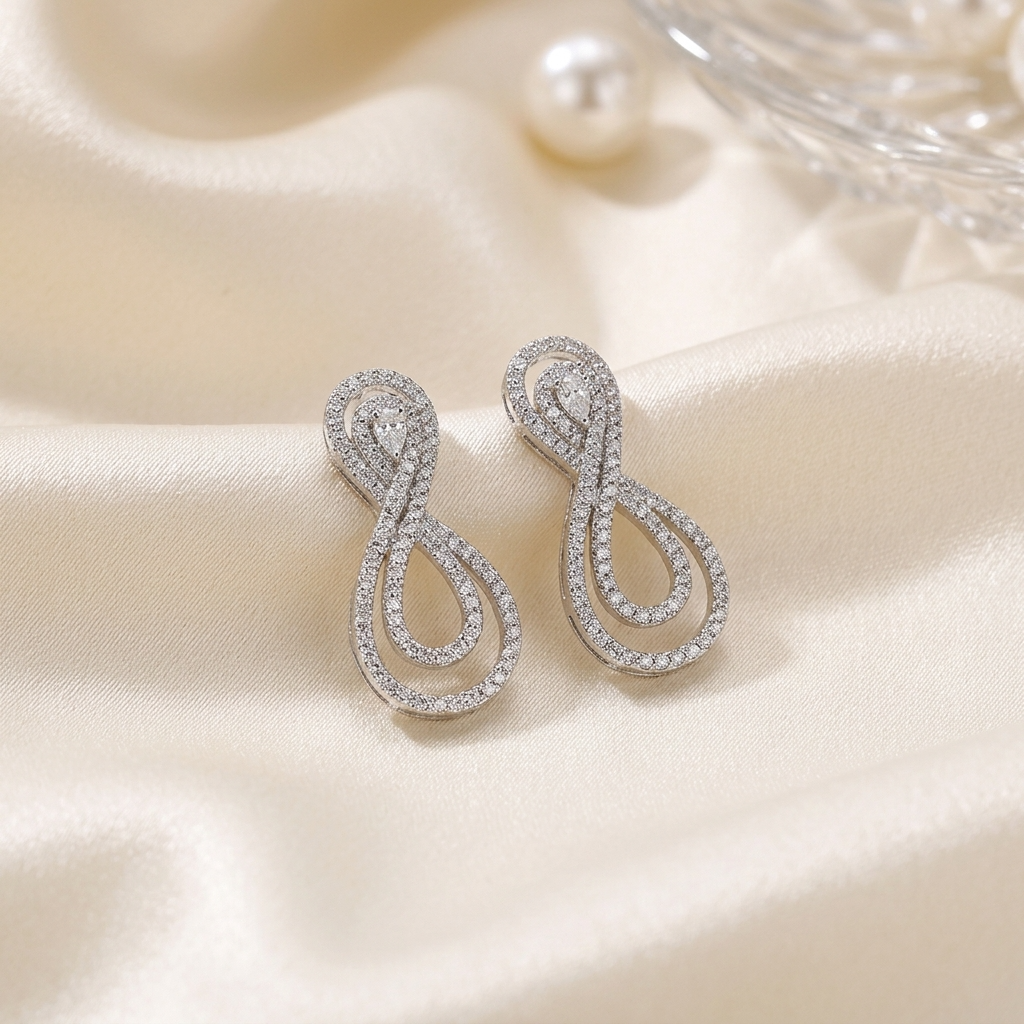 Pear shape diamond swirl earrings